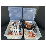 Garage… Tubs of assorted household items to include flat batteries, chair sliders, fasteners, power strip, bulbs, and more. See pictures for details.