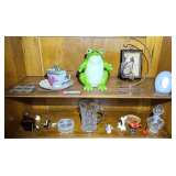 Master… Shelf lots of content of top two shelves marked 1083, includes a collectible, porcelain cup and saucer set, vintage Schmid Brothers ceramic frog, small vintage glass creamer pitcher, glass p