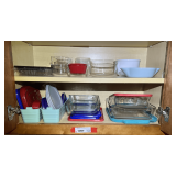 KIT… Shelf lot marked 1097 of content of two lower shelves, includes assorted glass storage containers, square glass bakeware with covers, and more. See pictures for details.