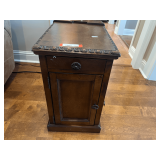 LR… Chair side power side table, believed to be from Ashley furniture. Comes with twin cup holders in pullout drawer, lower storage cubby, and built-in three outlet power strip. Tabletop has wear, s