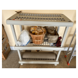 Garage… Portable plastic shelving with some content, see pictures for details.
