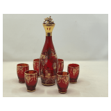 DR…Lovely Murano style Venetian glass decanter with six glasses. Ruby red with gold gilding, see pictures for details.