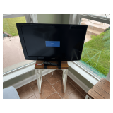 SUN…Insignia 32” LCD TV and DVD combo, powers up, comes with remote, working condition unknown, also includes a white and brown wood plank accent side table with metal frame, see pictures for deta