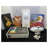 Assortment of household goods and decor to include a metal ornamental hanger, wall decor, “The Night Before Christmas” book, the Holy Bible on audio cassette, and more. See pictures for details.