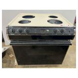 Kenmore oven and stove combo unit. Appears to be 220 V. Is missing top burners
