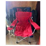 Set of seven camping chairs. Comes with one black foldable table