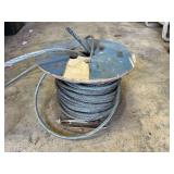D2-Partial spool of metal cable, see pictures for details.