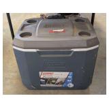 Coleman 50 QT rolling cooler with telescopic handle, see pictures for details.
