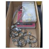 Assorted hose clamps, cardboard bin is not included, see pictures for details.