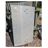 Aluminum hand truck dock plate featuring a diamond-tread slip-resistant surface.