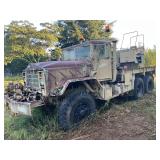 Military 5-ton 6x6 tactical heavy recovery/wrecker truck, has front mounted winch, and bumper mounted vise.