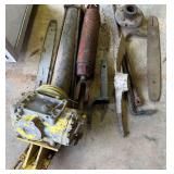 D2-Metal lot to include hydraulic lift cylinders, chainsaw bar, pickax head, metal hook, and more. See pictures for details.