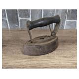Antique iron with wood handle, see pictures for details.