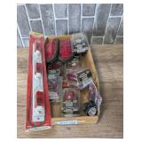 Assorted vehicle/trailer lighting, still new in the package, cardboard bin is not included, see pictures for details.