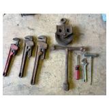 D2-Assorted hand tools to include pipe wrenches, pulley, vintage International Harvester P1184 3-way multi T-wrench, and more. See pictures for details.