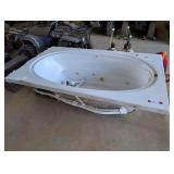 Approximately 6 foot Jacuzzi bathtub. Is fiberglass. Working condition unknown