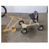 Yellow Steel Ride-On Toy Digger Excavator with Black Plastic Seat and Four Wheels