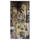 Assorted Automotive Accessories, Hardware, and More Hanging in Wall Area Marked Off as 5002