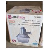 Utilitech dusk to dawn outdoor light, comes in original box, see pictures for details.