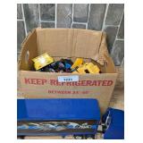 Assorted Toy Vehicle Lot Featuring Mack Semi Truck and Box of Mixed Cars, Trucks, and Construction Vehicles