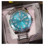 NEW- Invicta Pro Diver Aqua Blue Quartz Watch With a  Textured Dial and a Matching Teal Bezel. Has Original Tags and Box.