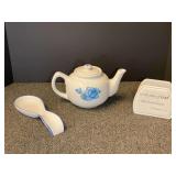 Ceramic napkin holder, spoon rest, and teapot with floral motif. See pictures for details.