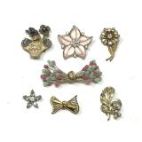 Lot of Seven Assorted Costume Jewelry Brooches Featuring Floral and Bow Motifs