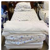Twin size bed, includes wooden headboard, mattress and boxspring, and bedframe. See pictures for details.