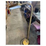 Adjustable head floor lamp, has a brass finish, see pictures for details.