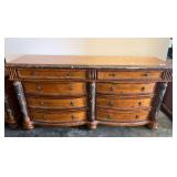 Eight drawer dresser with marble accents, Lionhead ring pulls, and bun feet from Canterbury home furnishings, matches lot 2001, does have top surface wear, see pictures for details.