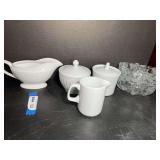 Assorted kitchenware to include a gravy boat, sugar and creamer, and more. See pictures for details.
