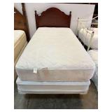 Twin size bed, includes wooden headboard, mattress and boxspring, and bedframe. See pictures for details.