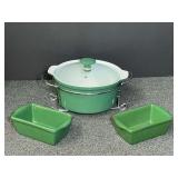 Enamel coated ceramic casserole dish with Stand, also includes two matching miniature loaf pans, see pictures for details.