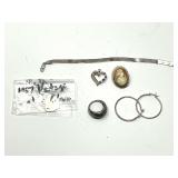 Assorted Jewelry Lot Including Sterling Silver Chain, Cameo Brooch, and Rings