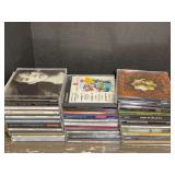 Assorted Music and Audio Compact Disc Lot with CD Storage Case