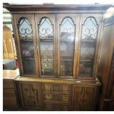 Bassett furniture two-piece China cabinet with hutch, has three drawers and two side cabinets, see pictures for details.