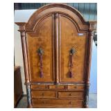 Lovely bedroom armoire with lion-head ring pulls, marble accents, and bun feet from Canterbury home furnishings. see pictures for details.