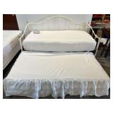 White, metal framed daybed with trundle. Finials are included, one finial screw is missing, see pictures for details.