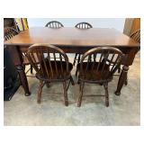 Wooden, rectangular farmhouse table with six bow back chairs, see pictures for details.