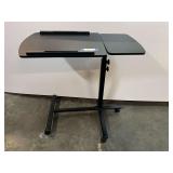 Mobile rolling laptop cart or adjustable overbed table. See picture for details.