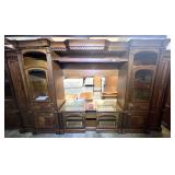 Ashley furniture multi-piece entertainment center wall unit, featuring two glass-door side piers, a matching top bridge, and an underlying console unit, must see to appreciate. See pictures for detail