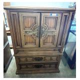 Vintage Bassett double door armoire, has three lower drawers, two drawers and one shelf in cabinet. See pictures for details.