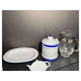 Assorted kitchenware to include a mid-century modern cocktail pitcher, stoneware honey jar, teabag rest, and more. See pictures for details.