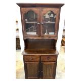 Custom wooden dining hutch with a glass-paneled upper cabinet, a middle counter space, and a lower storage cabinet with two drawers and two doors. See pictures for details.