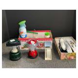 Household Mixed Lot Including Sunbeam Scale, Lanterns, Remotes, and Cleaning Supplies