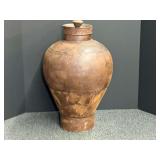 Distressed metal urn with lid, see pictures for details.