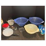 Assorted kitchenware to include colanders, storage containers, shot glasses, and more.  See pictures for details.