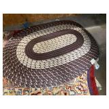 Assorted Rug Lot Including Braided Oval Rugs and Woven Area Rug
