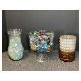Tiramisu bowl with multicolor glass pebbles, vase with clear glass pebbles, also includes a hurricane candle holder. See pictures for details.
