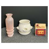 Assorted home decor to include a ceramic strawberry planter, frosted pink vase, and “The Quilt Shop” music box. See pictures for details.